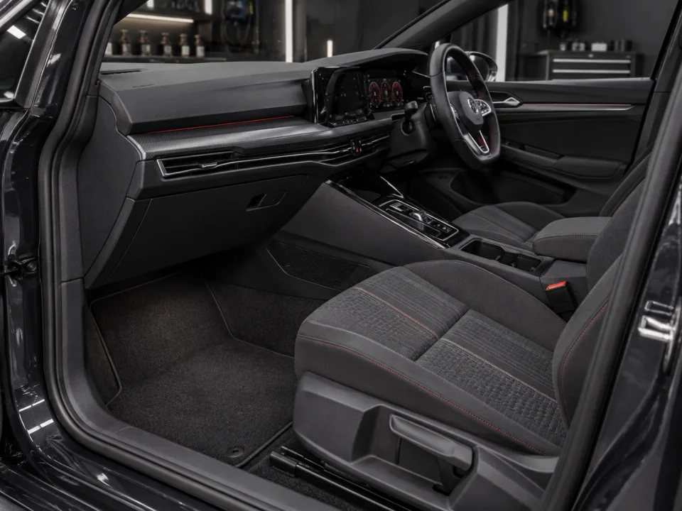 Clean car interior with freshly detailed seats and console